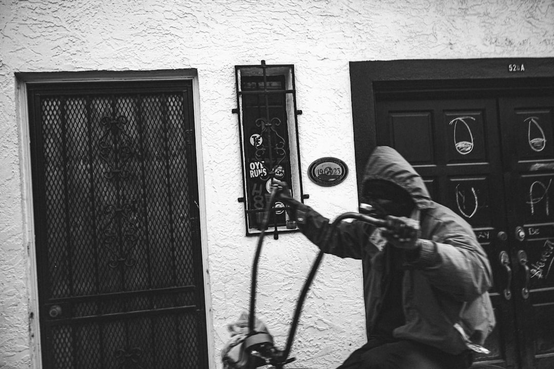 a man on a scooter in front of a building